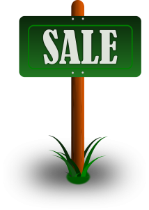 Green Wooden Sale Sign On Grass Free Download